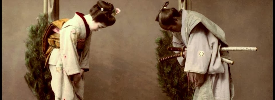 Japanese Bowing To Each Other