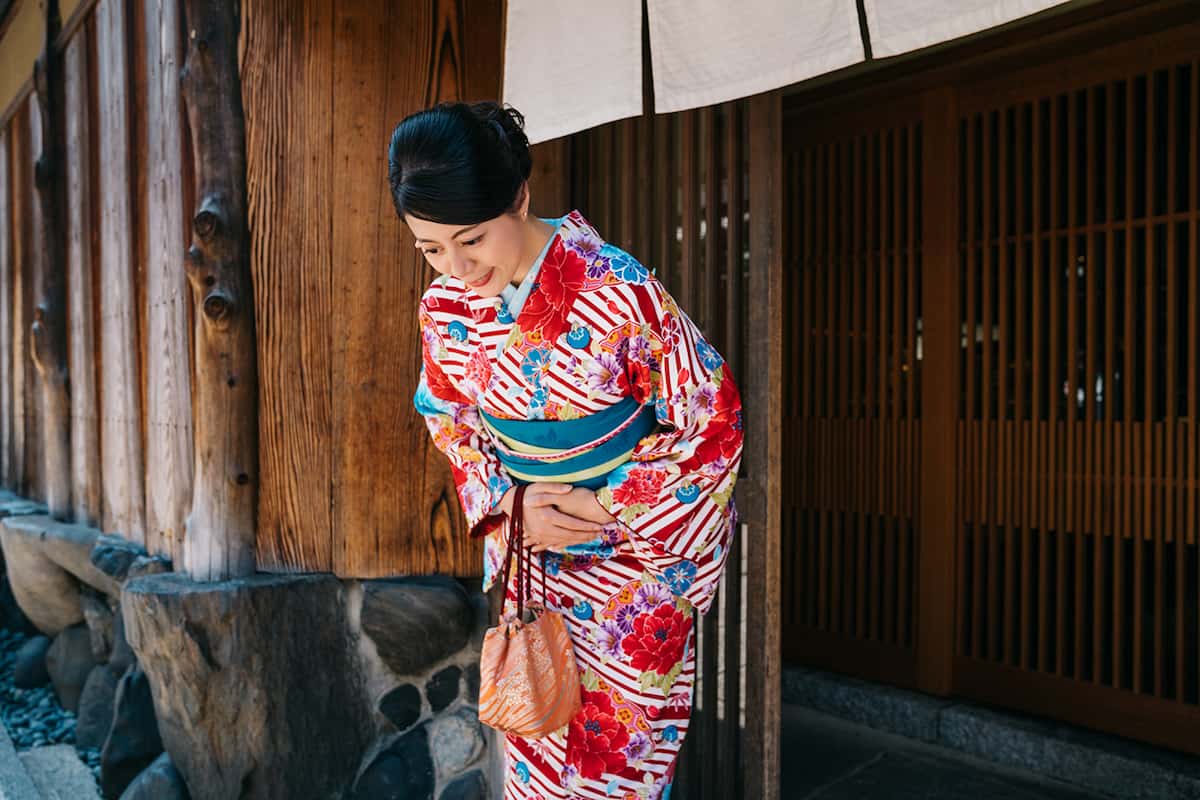 Japanese Woman Bowing to the Land Of The Rising Son