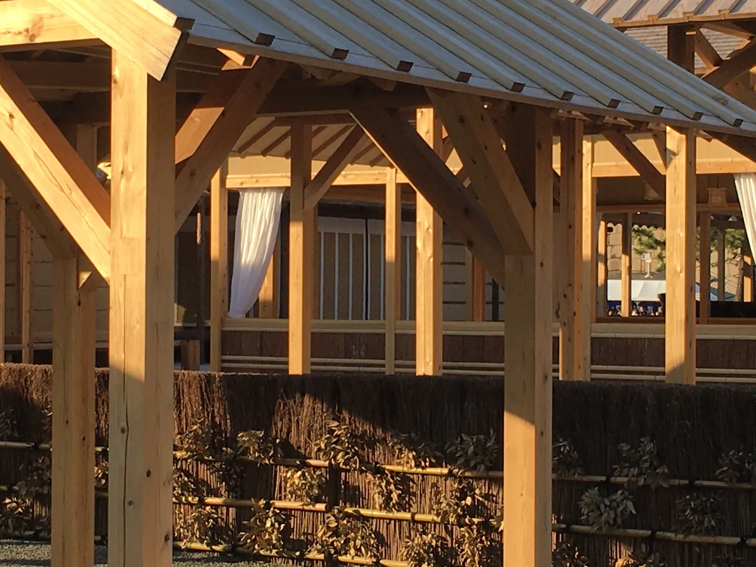 A close view of the Daijōkyū's unpainted timber frame and woven brushwood fence.